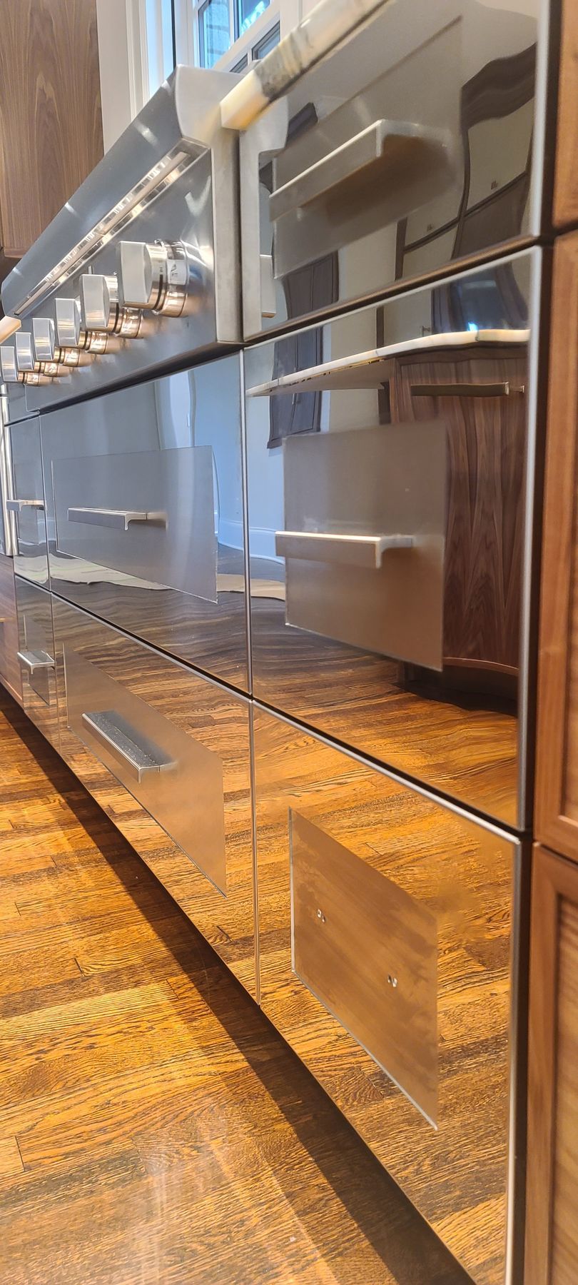 A close up of a stainless steel refrigerator in a kitchen.