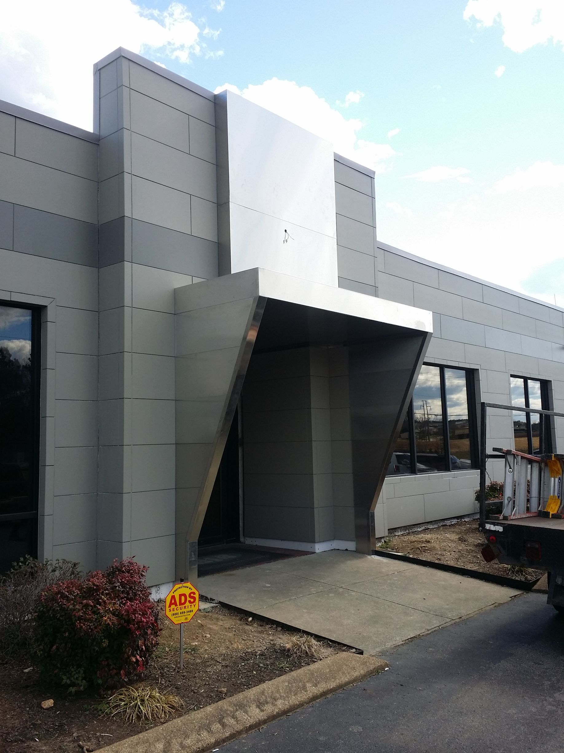 A large building with a no parking sign in front of it