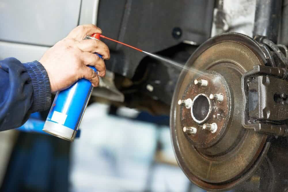 A Man is Working on the Air Filter of a Car — Aspire Diesel In Bouldercombe, QLD