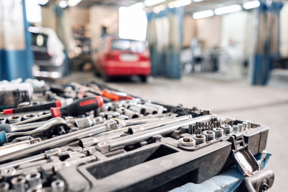 A Bunch Of Tools Are Sitting On A Table In A Garage — Aspire Diesel In Gracemere, QLD