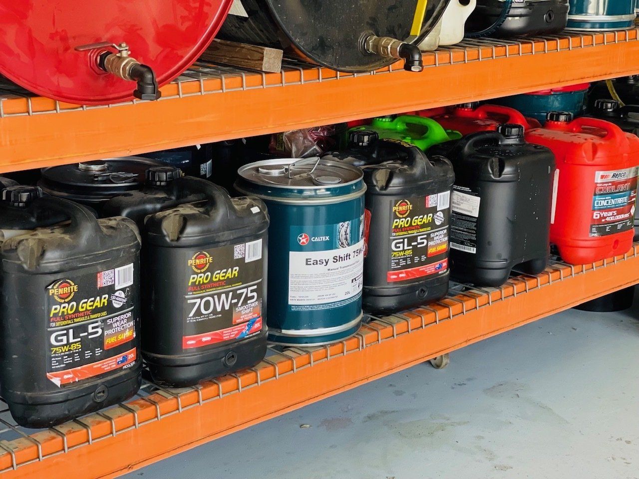 A Shelf Filled With Lots Of Different Types Of Oil — Aspire Diesel In Gracemere, QLD