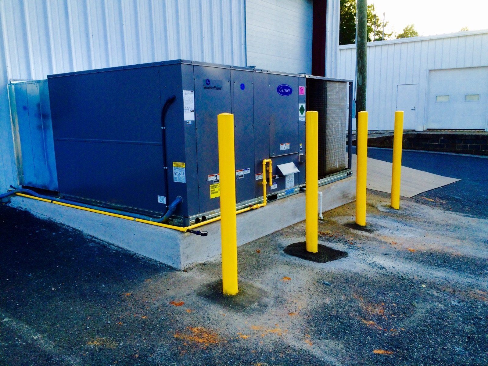 An industrial sized heater in a parking lot