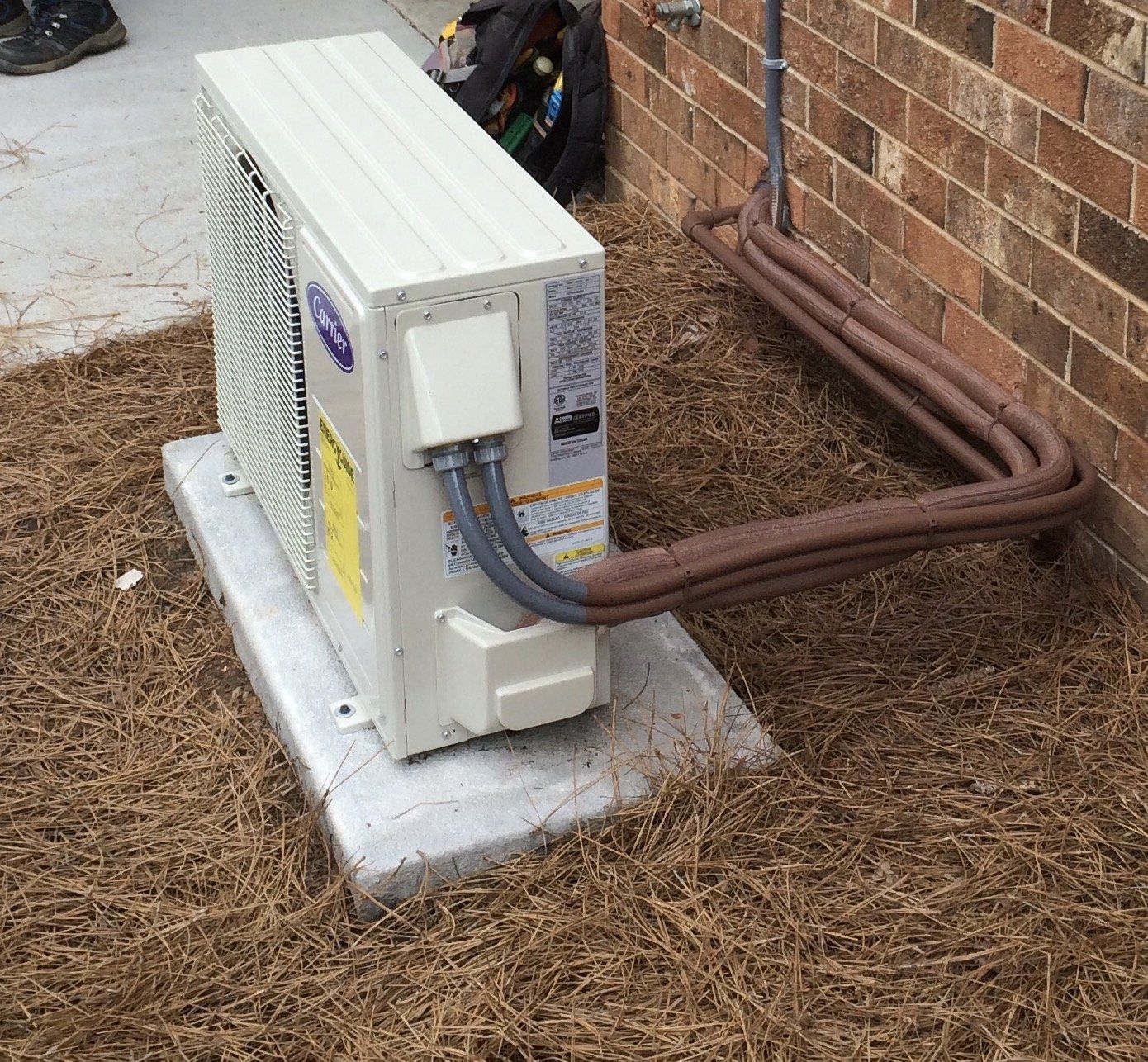 A small air conditioner attached to a house