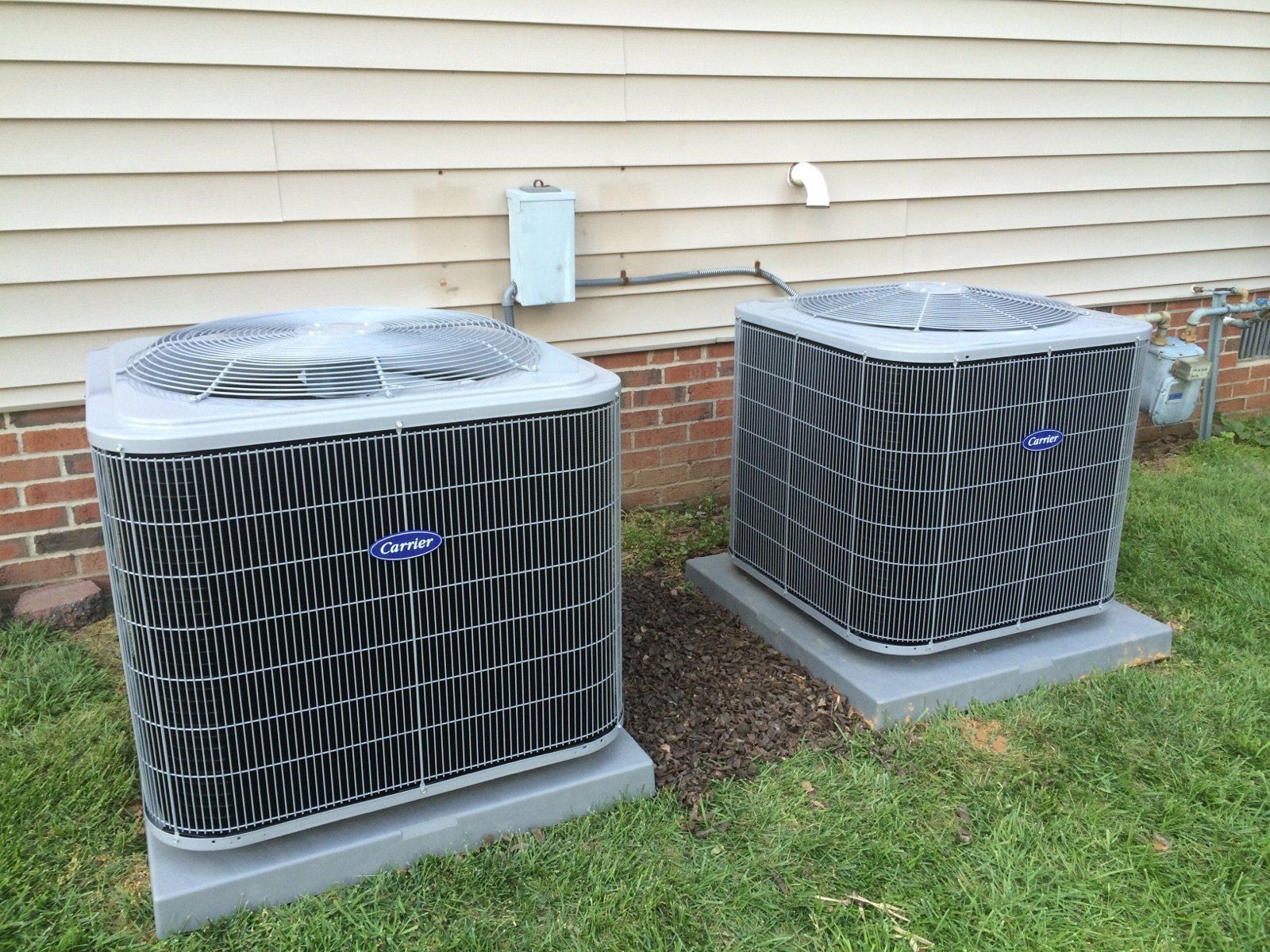 Two air conditioning units outside