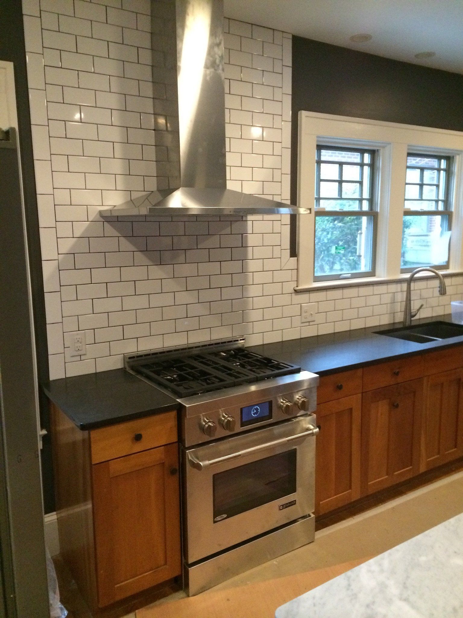 A stove with a vent above it