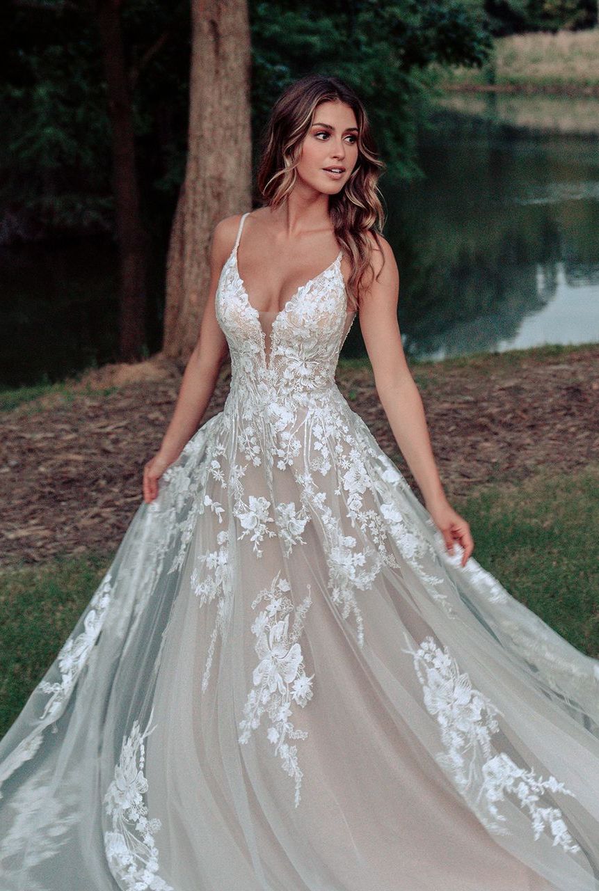 Pure romance at every turn, this softly shimmering A-line gown features sequins, beadwork and dimensional lace. Champagne/Ivory/Nude. Wedding Dress by Allure Bridals