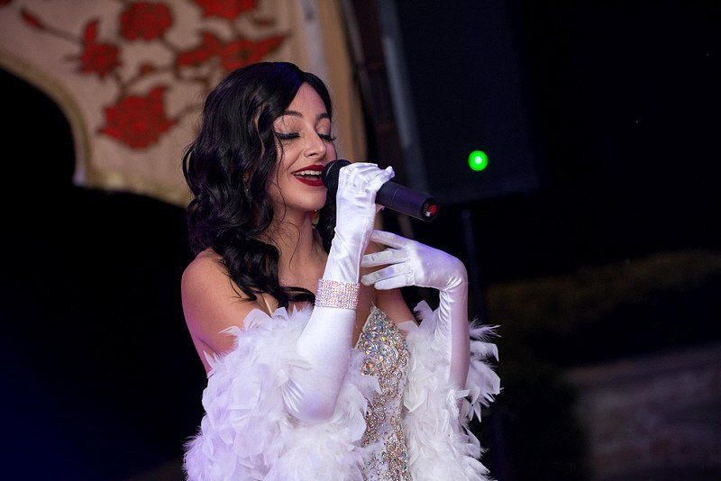 Adult Social Event 1940s style cabaret singer dressed in white gown