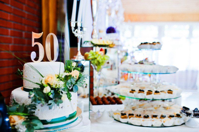 Adult Social Event 50th annivesary cake with silver numbers on top of cake