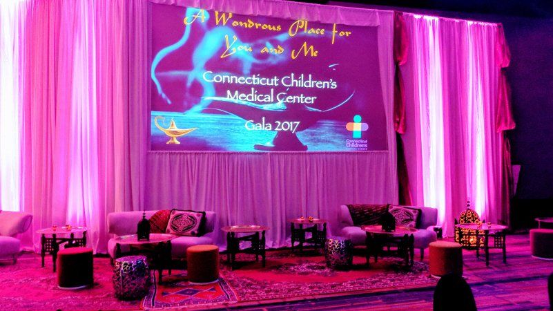 Galas and fundraising Arabian nights themed event with stage  setup