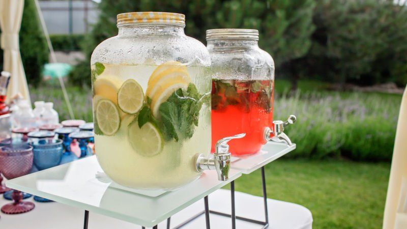Backyard party beverages served in large jars