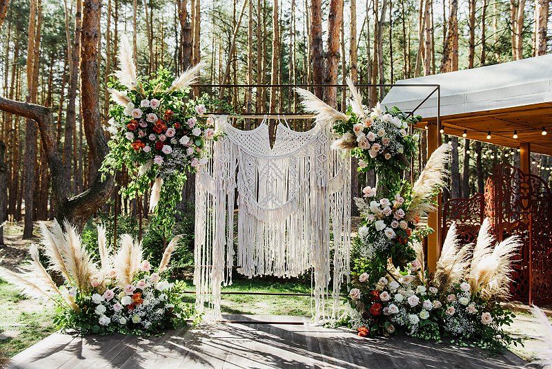 Wedding celebration Bohemian wedding decor with a laced hanging backdrop