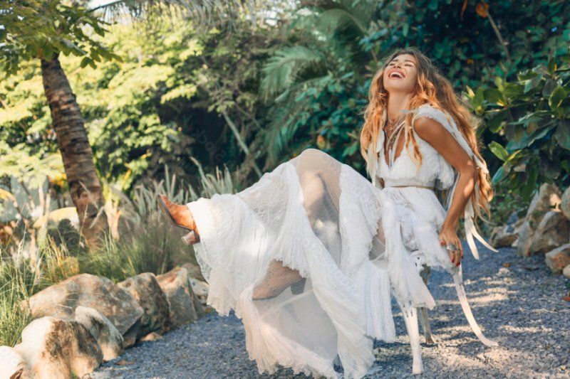 Wedding celebration woman wearing a Bohemian styled white wedding dress