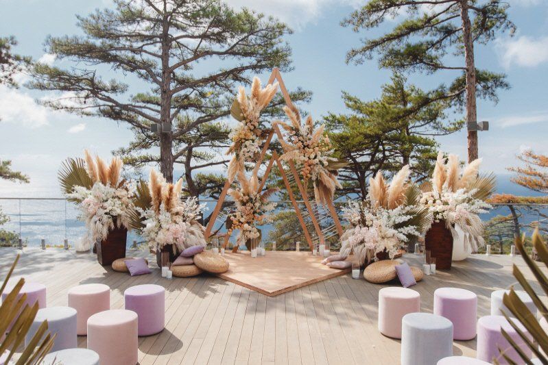 Wedding celebration Bohemian styled outdoor seating and ceremony arrangement