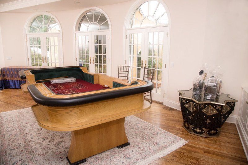 Adult Social Event Casablanca theme with a craps table setup