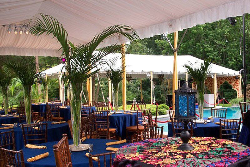 Adult Social Event Casablanca theme with outdoor palm tree centerpieces