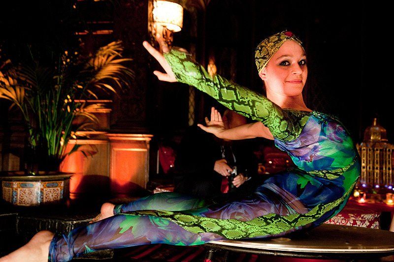 Specialty acts image showing contortionist in twisting pose