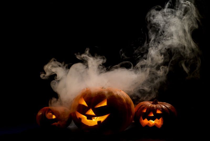 creepy pumpkins with smoke emerging
