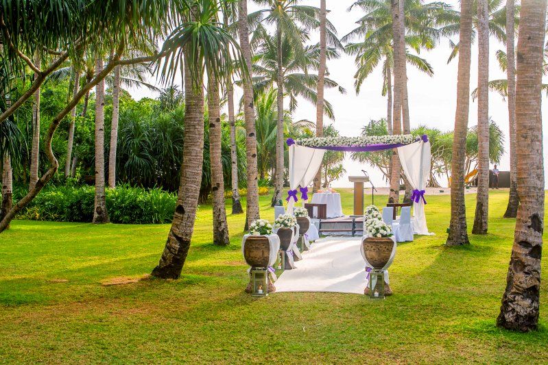 Wedding celebration Hawaiian styled outdoor ceremony setup