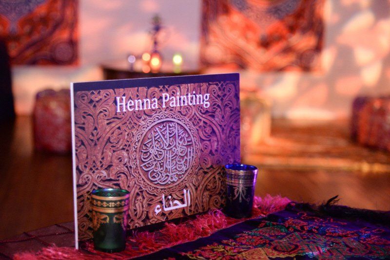 Interactive entertainment image showing aHenna Painting station signage