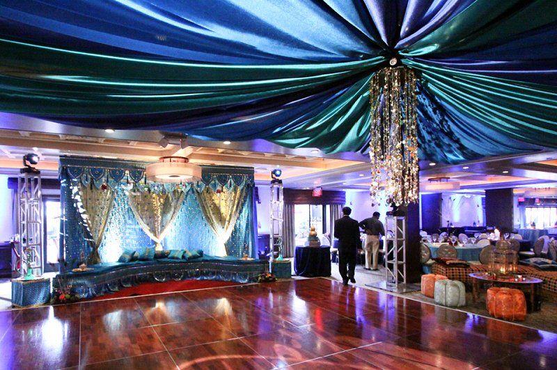Wedding celebration Indian style stage setting with a dropped ceiling