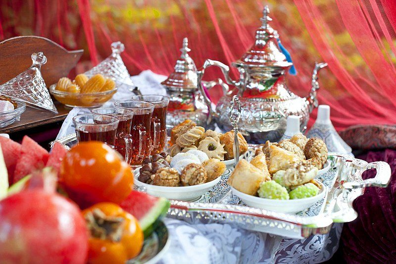 Wedding celebration with Moroccan and Arabian style sweets and various fruit and tea