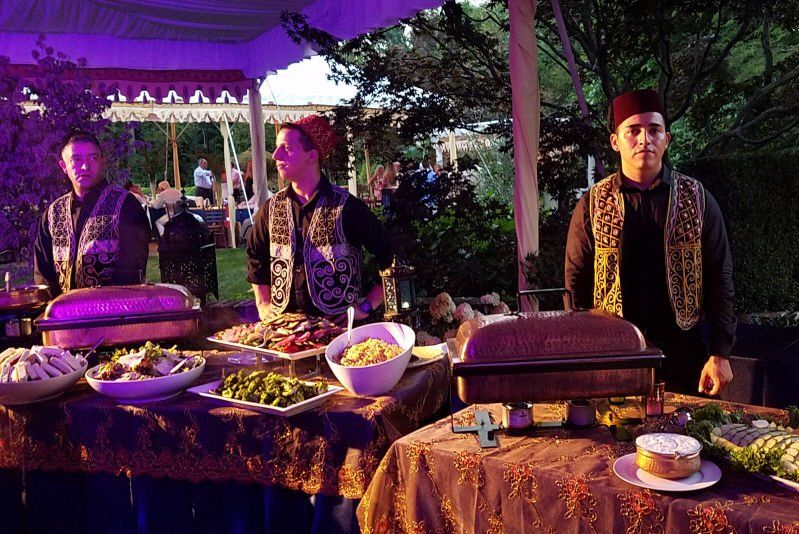 Adult Social Event Moroccan styled buffet table with costumed waiters