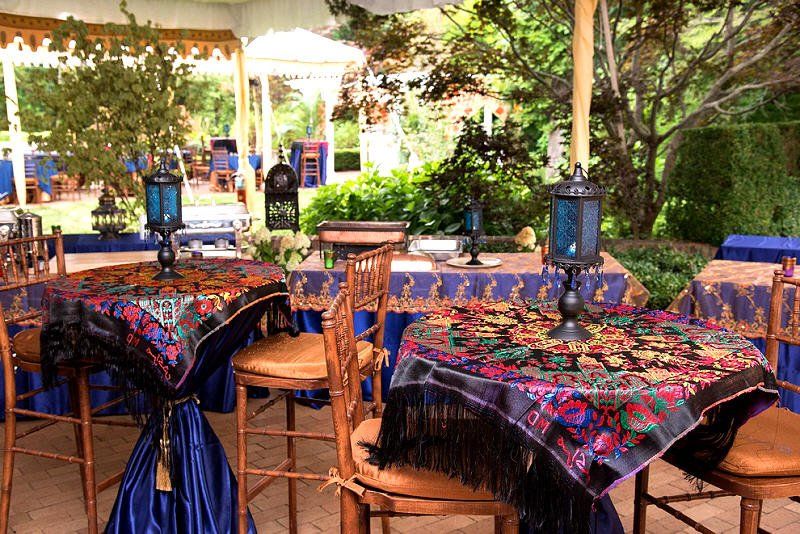 Adult Social Event Moroccan styled table settings in outdoor tent