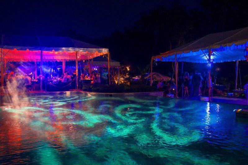 Adult Social Event pool lighting design with green lighting showing in water