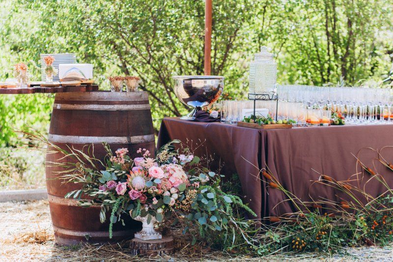 Wedding celebration rustic styled bar and buffet table