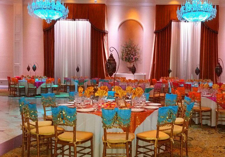 Teen birthday party Aladdin themed sweet 16 showing table setting and room setup