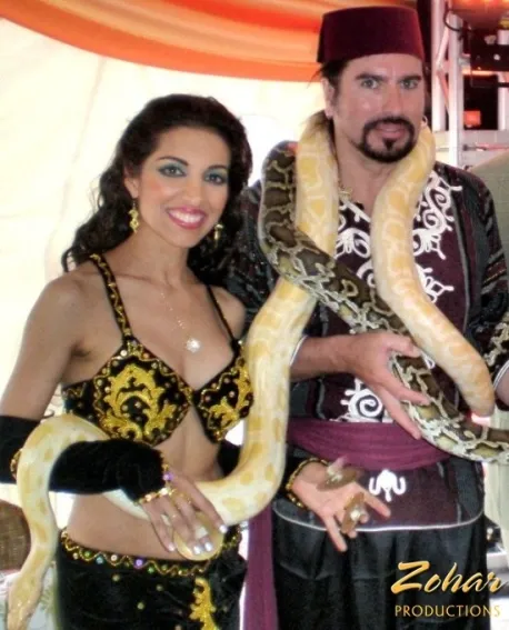 Snake charmers provide a wonderful photo opportunity for party guests.