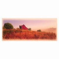 Red barn on a hill in a field of tall, red grass, under a hazy, colorful sky.