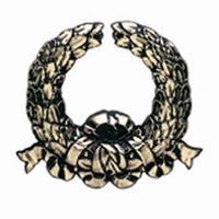 Silver wreath with a ribbon at the bottom.