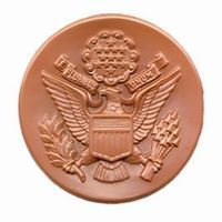 Brown chocolate coin with a detailed embossed Great Seal of the United States.