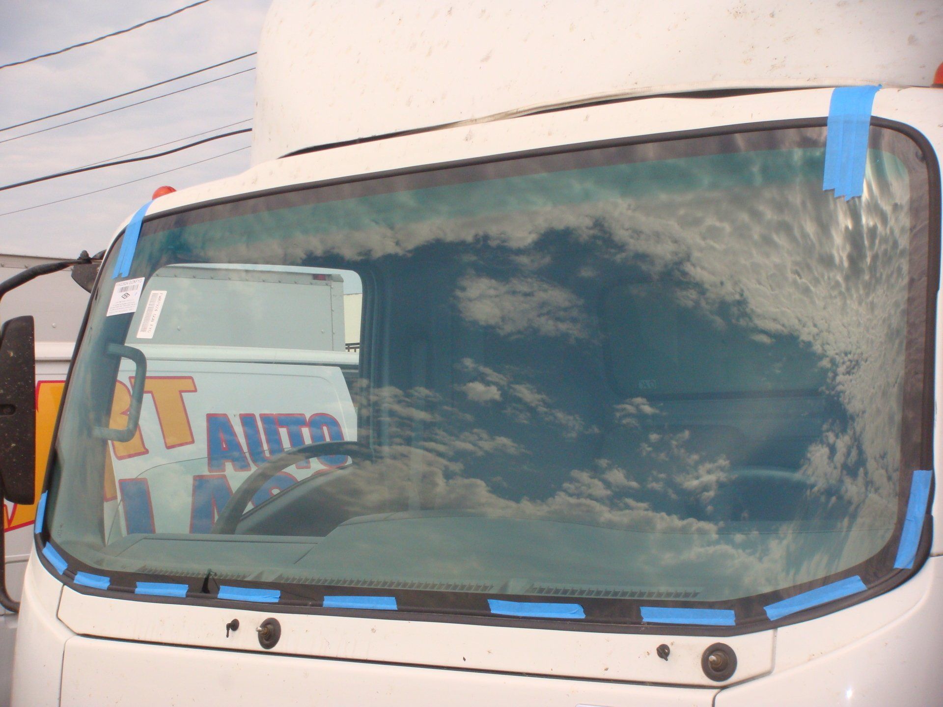 White Truck With A Windshield — Orange, CA — Auto & Marine Upholstery Experts