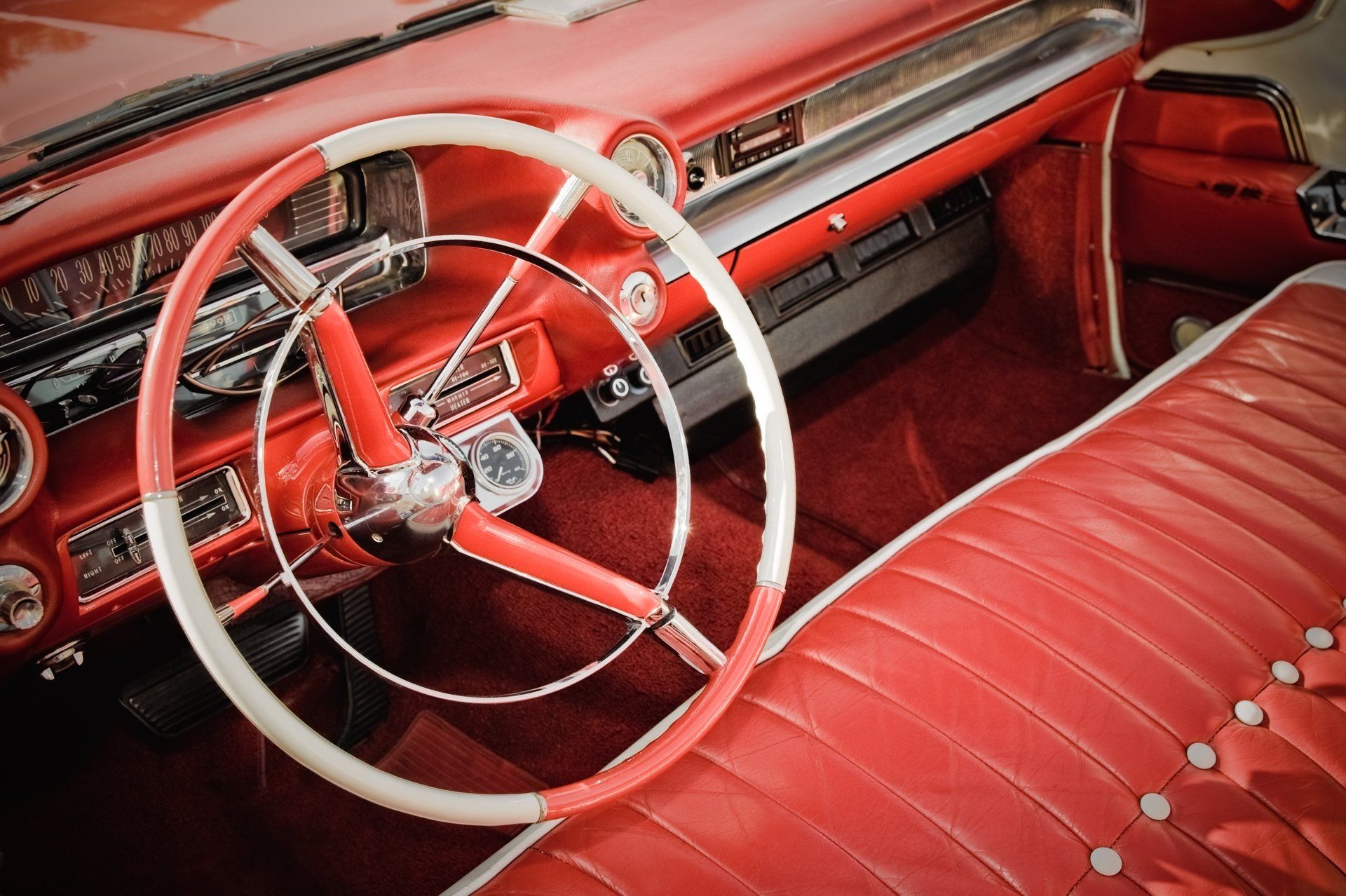 A Red Car With A White Steering wheel — Orange, CA — Auto & Marine Upholstery Experts