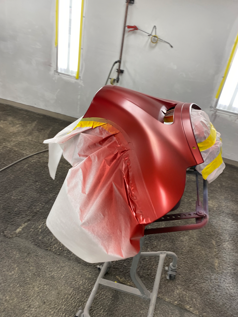 A Shiny, Red Exterior Auto Body Part Painted By Lutz's Garage's Mechanics in Jefferson City, MO