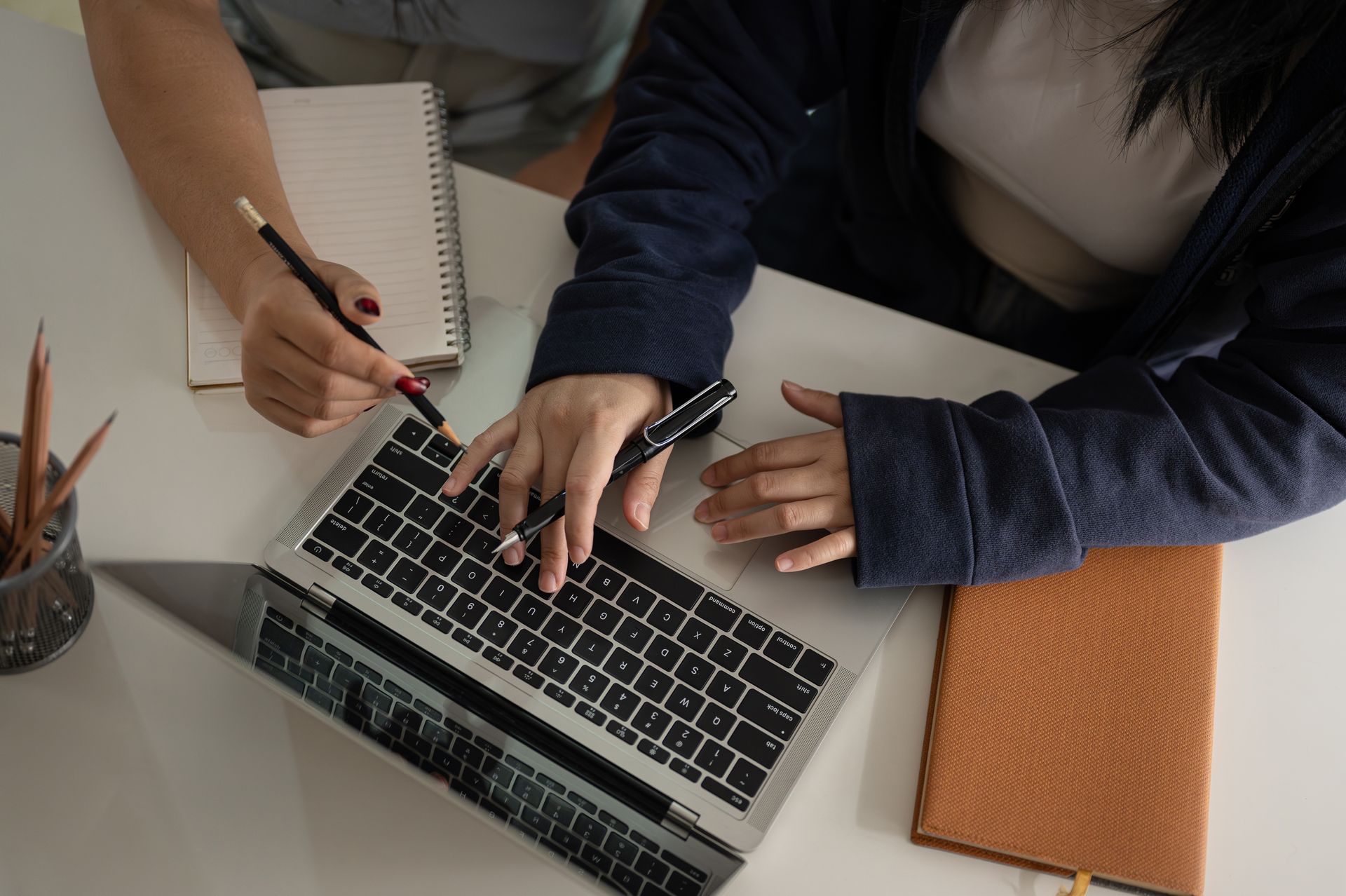 Two people working together at a table