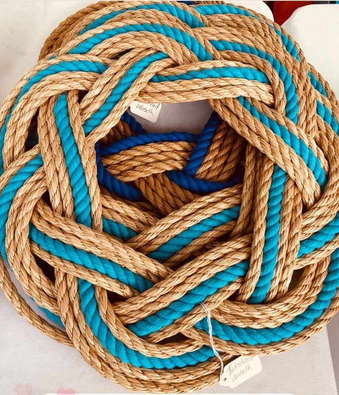A knotted rope with a tag that says ' rope ' on it