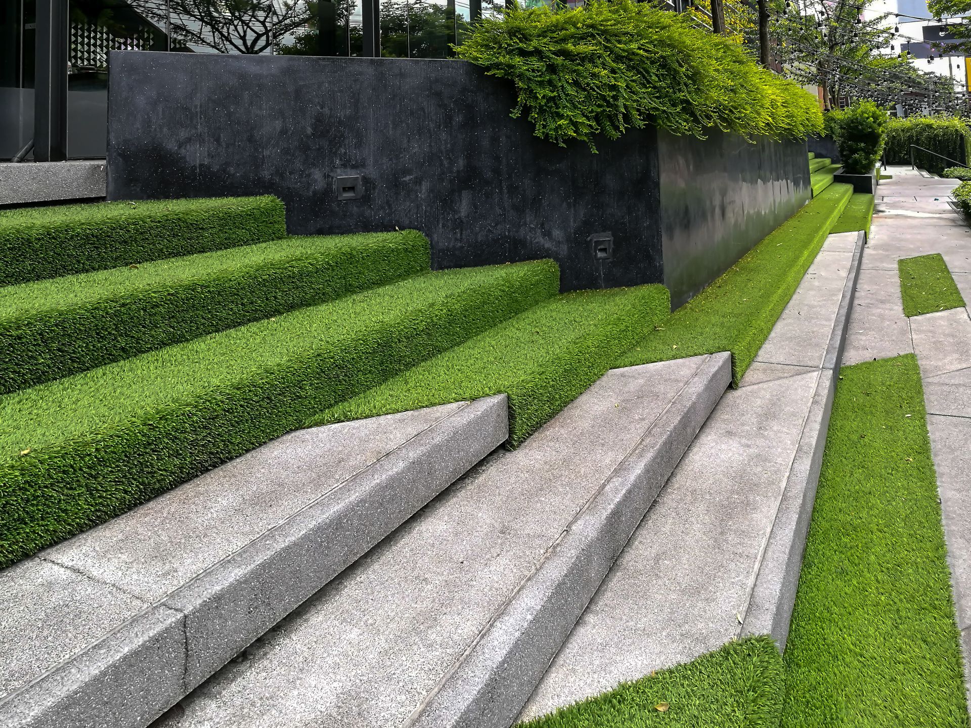 A set of stairs surrounded by grass and bushes