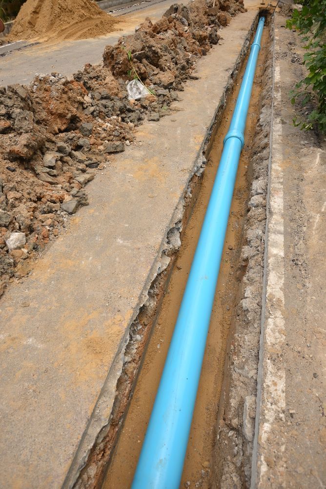 Blue Pipe in a Trench — Ian Stanley Plumbing In Avoca, QLD