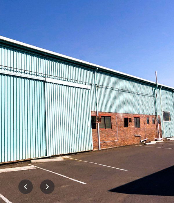 Warehouse Building — Ian Stanley Plumbing In Avoca, QLD