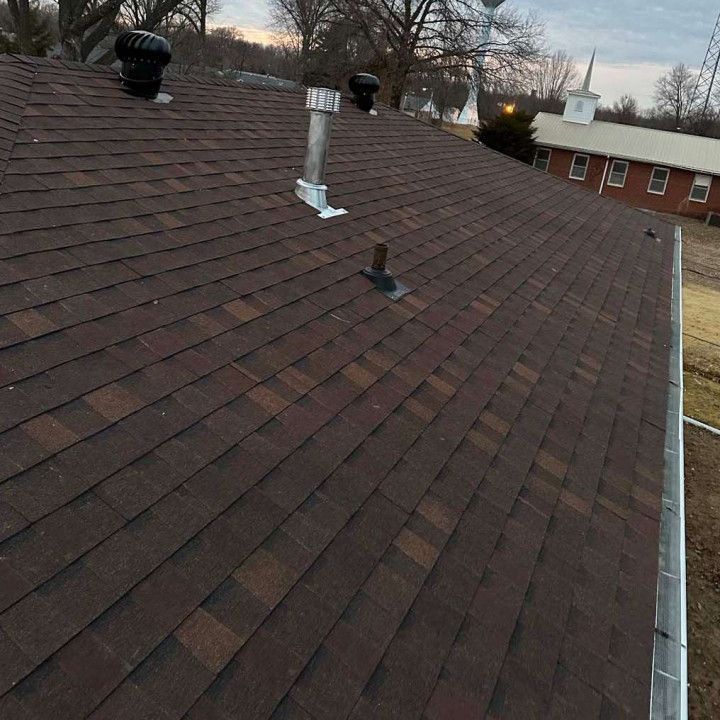 A brown roof with a chimney on top of it