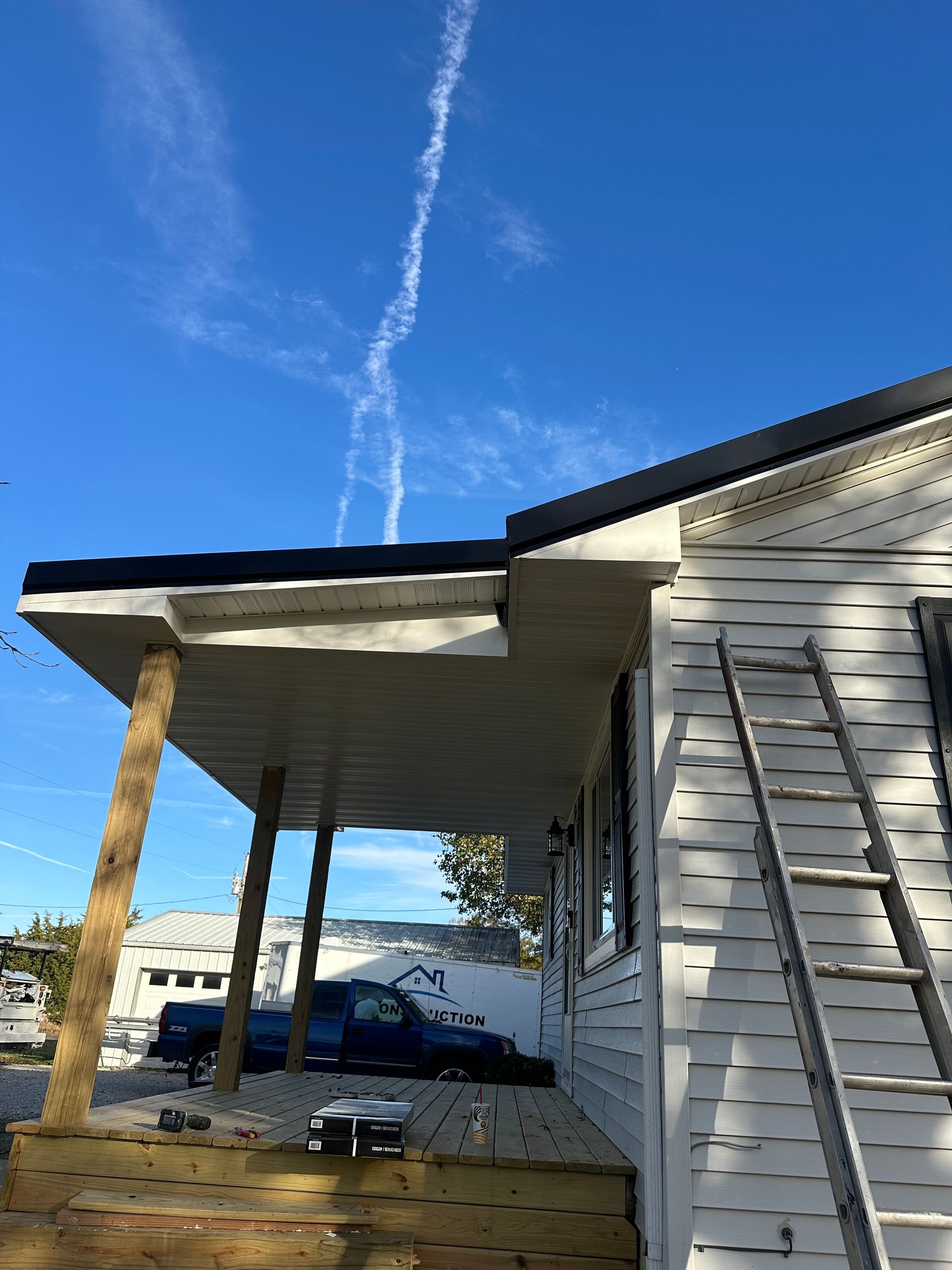 The roof of a house with a chimney on it.