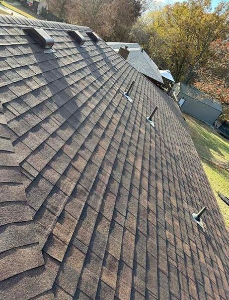 A close up of a roof with a lot of shingles on it.