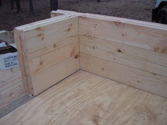 Wooden corner construction with plywood base. 