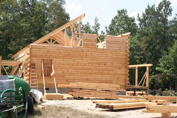 Log cabin construction in progress.