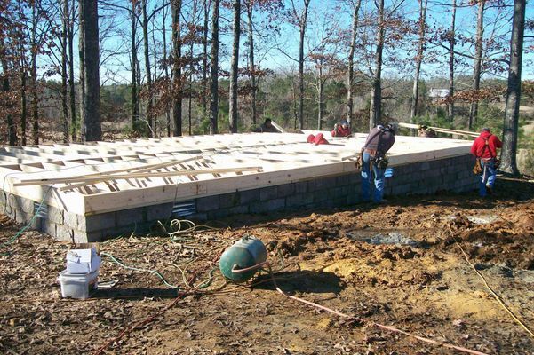 Construction of a wooden building foundation.