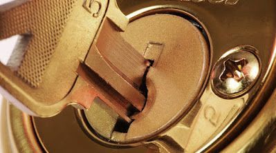 A close up of a key in a lock.