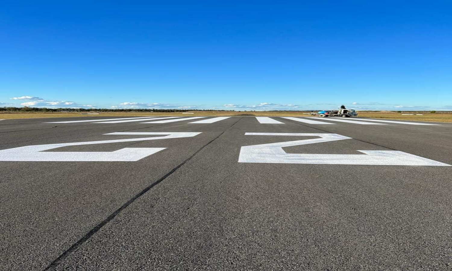 A Plane Is Taking Off From An Airport Runway — Spraywayz Linemarking Pty Ltd In Booral, QLD